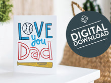 Load image into Gallery viewer, A greeting card is featured on a white tabletop with a white planter in the background with a green plant. There’s a woven basket in the background with a cactus inside. The card features the words “Love You Dad” with an illustrated baseball as the “O” of love and a baseball bat featured at the bottom of the words. The words &quot;digital download&quot; are featured in a circle on top of the image. 