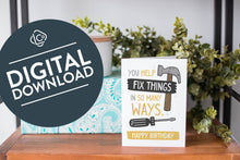 Load image into Gallery viewer, A greeting card is on a table top with a present in blue wrapping paper in the background. On top of the present is a candle and some greenery from a plant too. The card features the words “You help fix things in so many ways. Happy Birthday” featuring an illustrated hammer. The words &quot;digital download&quot; are featured in a circle on top of the image. 
