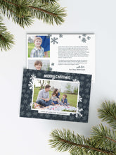 Load image into Gallery viewer, A photo of a Christmas card showing the front and back of the card laying on a white surface. Around the two sides of the card are pine needles. The front of the card features a photo with a frame around it with illustrated snowflakes. Above the photo reads “Merry Christmas” and below the photo you can add your family name. The back of the card features two photos, illustrated snowflakes and a place to add a family update.