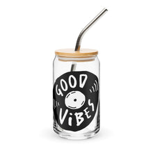 Load image into Gallery viewer, A photo of a glass can tumbler on a white background with a bamboo lid and silver metal straw. The design on the glass tumbler says the words "good vibes" inside an illustrated vinyl record.