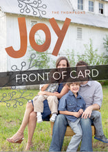 Load image into Gallery viewer, A close up of the front of the card showing the front of the card design. Across the image is a gray strip with the words “front of card” on it. The front of the card features a photo with the word “Joy” in an orange-red color and some gray illustrated modern leaves.
