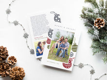 Load image into Gallery viewer, A photo of a double-sided Christmas card showing the front and back of the card laying on a white surface. Around the two sides of the card are pine cones, pine needles and a string of silver snowflake garland. The front of the card features a photo with the words Merry & Bright at the top and illustrated ornaments around the photo. The back of the card features two photos, illustrated ornaments and space to write a family update.