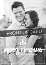 Load image into Gallery viewer, A close up of the card showing the photo and design features. Across the image is a gray strip with the words “back of card” on it. The photo card features one photo with the words “Merry Christmas” with illustrated pine trees above the words. There’s a family name under the words which you can edit with your name.
