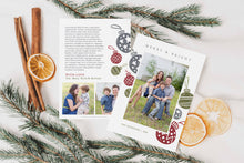 Load image into Gallery viewer, A photo of a double-sided Christmas card showing the front and back of the card laying on a white surface. Around the two sides of the card are pine needles, cinnamon sticks and dried oranges. The front of the card features a photo with the words Merry & Bright at the top and illustrated ornaments around the photo. The back of the card features two photos, illustrated ornaments and space to write a family update.