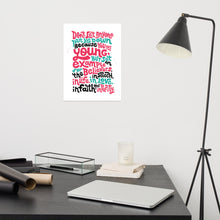 Load image into Gallery viewer, A white print featured on a wall above a desk. The print reads &quot;Don&#39;t let anyone put you down because you are young, but set an example for the believers, in speech, in life, in love, in faith and in purity.&quot; The lettering is in red, blue and black. 