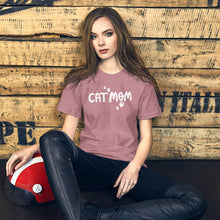Load image into Gallery viewer, A T-shirt in orchid pink color with Cat Mom in white lettering in the center of the shirt surrounded by heart shaped paws. This tee is a lovely gift for cat lovers. 