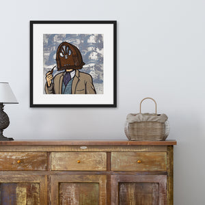 A black frame above a a brown dresser featuring an illustration of a vintage radio as a "head" of a person in a suit who is smoking a pipe.