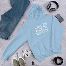 Load image into Gallery viewer, A light blue hoodie laying on the ground with objects around it. The hoodie features hand drawn lettering in white with the words "May the God of hope fill you with all joy and peace as you trust him."