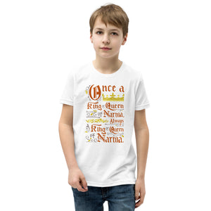 A boy wearing a white short sleeved T-Shirt. The artwork features hand drawn lettering of the Narnia quote "Once a king or queen of Narnia, always a king or queen of Narnia."