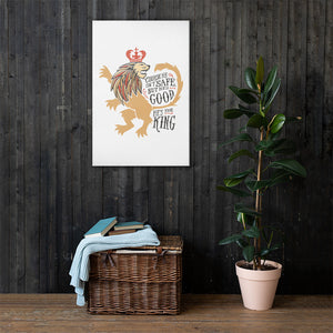 A white canvas hanging on a wood panel wall with a basket and plant below it. The artwork features hand drawn illustration of the Chronicles of Narnia lion character Aslan. Inside the illustration there is the quote "Course He Isn't Safe, But He's Good. He's the King."