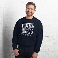 Load image into Gallery viewer, A man wearing a navy sweatshirt featuring hand drawn lettering in white with the words &quot;Our creativity is an outflow of His.&quot;