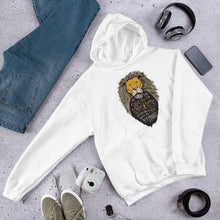 Load image into Gallery viewer, A white hoodie laying on the ground with objects around it. The hoodie features hand drawn illustration of the Chronicles of Narnia lion character Aslan. Inside the illustration there is the quote “At The Sound of Your Roar, Sorrows Will Be No More.”