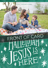 Load image into Gallery viewer, A close up of the front of the card showing the front of the card design. Across the image is a gray strip with the words “front of card” on it. The front of the card features a photo on the top and on the bottom is in green with words in white “Hallelujah Jesus is Here” with white stars around it. 