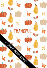 Load image into Gallery viewer, A close up of the card design with the words “instant download” over the top. The card features the word &quot;Thankful&quot; with a pattern of illustrated pumpkins and leaves behind the word. 