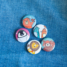 Load image into Gallery viewer, Five button pins are on a jean jacket. The buttons feature illustrated cats, a bear, a penguin, a lion and a red panda.