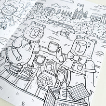 Load image into Gallery viewer, A close up of one of the colouring pages featuring with animals picnicking in Hyde Park.