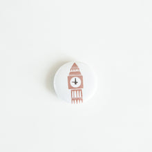 Load image into Gallery viewer, A button on white tabletop. The button features an illustration of Big Ben. 