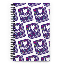 Load image into Gallery viewer, A spiral notebook is on a tabletop. The white spiral notebook has black spiral binding. The pattern design features the words &quot;I love books&quot; inside an illustrated book with the word love as a heart. 