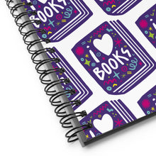 Load image into Gallery viewer, A close up of the spiral notebook binding. The pattern design features the words &quot;I love books&quot; inside an illustrated book with the word love as a heart. 