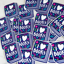 Load image into Gallery viewer, Vinyl die cut stickers featuring the words &quot;I Love Books&quot; inside an illustrated book. 