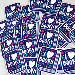 Vinyl die cut stickers featuring the words "I Love Books" inside an illustrated book. 