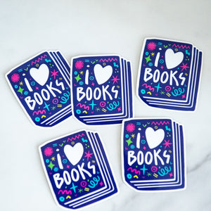 Vinyl die cut stickers featuring the words "I Love Books" inside an illustrated book. 