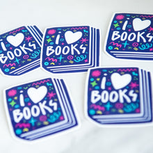 Load image into Gallery viewer, Vinyl die cut stickers featuring the words &quot;I Love Books&quot; inside an illustrated book. 