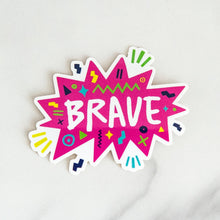 Load image into Gallery viewer, A vinyl die cut sticker with the word &quot;brave&quot; featured inside a pink star-like shape with fun sketchy elements around it. 