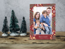 Load image into Gallery viewer, A photo of a one-sided Christmas card showing the front of the card standing up with three small Christmas trees next to it. The photo card features one photo with a frame of illustrated leaves in various colors. Below the photo it reads “Rejoice Greatly” and has space to put your family name. 