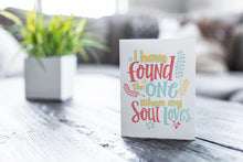 Load image into Gallery viewer, A greeting card featured on a black, wood coffee table. There’s a white planter in the background with a green plant. There’s also a gray sofa in the background with a white pillow. The card features the words “I have found the one whom my soul loves.”