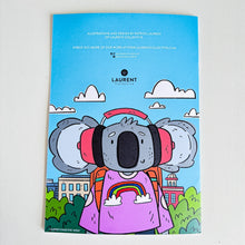 Load image into Gallery viewer, A photo of the back of the Animals in London colouring book featuring a koala wearing headphones.