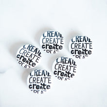 Load image into Gallery viewer, Buttons on a white tabletop. The buttons feature word art illustrations with the word &quot;Create&quot; repeated four times.