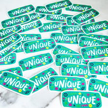 Load image into Gallery viewer, Vinyl die cut stickers with the word &quot;unique&quot; and sketchy elements surrounding the word. 