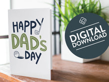 Load image into Gallery viewer, A greeting card is featured on a wood coffee table with a green plant in a white planter in the background. The card features the words “Happy Dad’s Day” with an illustrated golf club and golf ball. The words &quot;digital download&quot; are featured in a circle on top of the image. 