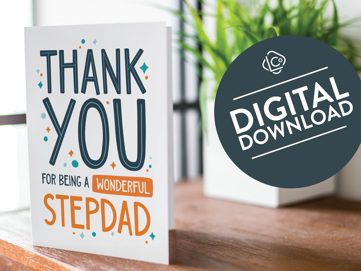 A greeting card is featured on a wood coffee table with a green plant in a white planter in the background. The card features the words “Thank You for Being a Wonderful Stepdad.” The words 