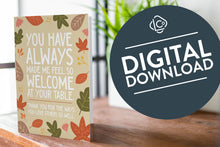 Load image into Gallery viewer, A photo of a card featured on a tabletop next to a white planter filled with a green plant. ​​The card features the words &quot;You have always made me feel so welcome at your table. Thank you for the ways You love others so well&quot; with illustrated leaves surrounding the words. The words &quot;digital download&quot; are featured in a circle over the image.