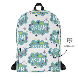 A backpack on a white background with a pattern design with the word "dream" inside a cloud illustration with sketchy elements. A note on the side shows the detail of the inside pocket. 