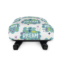 Load image into Gallery viewer, A backpack on a white background with a pattern design with the word &quot;dream&quot; inside a cloud illustration with sketchy elements. The backpack is laying down to show the bottom of the backpack.