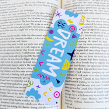 Load image into Gallery viewer, A close up of a bookmark featuring the word &quot;dream&quot; inside an illustrated cloud. 