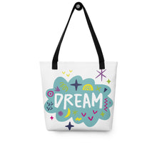 Load image into Gallery viewer, A white tote bag with black handles on a white background. The bag features a design with the word &#39;dream&#39; with an illustrated cloud around the word with colorful sketchy around. 