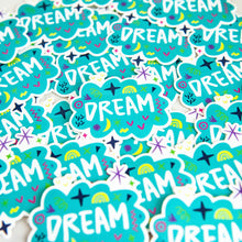 Load image into Gallery viewer, Vinyl die cut stickers with the word &quot;dream&quot; featured inside an illustrated cloud-shape with cute sketchy items around. 