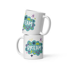 Load image into Gallery viewer, Two white mugs stacked on top of each other.  The mug features a design with the word &#39;dream&#39; in an illustrated cloud with sketchy elements around it. 