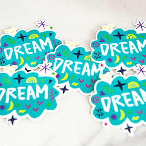 Vinyl die cut stickers with the word "dream" featured inside an illustrated cloud-shape with cute sketchy items around. 