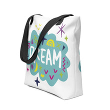 Load image into Gallery viewer, A side view of a white tote bag with black handles on a white background. The bag features a design with the word &#39;dream&#39; with an illustrated cloud around the word with colorful sketchy around. 