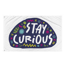 Load image into Gallery viewer, A large flag featured on a white background. The white flag features the words &quot;stay curious&quot; featured inside a a purple shape with sketchy illustrations around. 