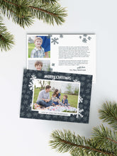 Load image into Gallery viewer, A photo of a Christmas card showing the front and back of the card laying on a white surface. Around the two sides of the card are pine needles. The front of the card features a photo with a frame around it with illustrated snowflakes. Above the photo reads “Merry Christmas” and below the photo you can add your family name. The back of the card features two photos, illustrated snowflakes and a place to add a family update. 