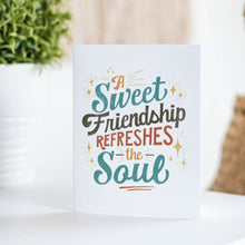 Load image into Gallery viewer, A white greeting card sitting on a a white table top with the words &quot;A Sweet Friendship Refreshes the Soul.&quot;