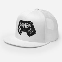 Load image into Gallery viewer, A white trucker hat on a white background showing an angel view of the hat. The hat features an embroidered design with an illustrated game controller with the word &#39;gamer&#39; inside the illustration.  