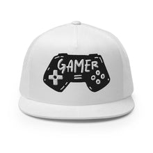 Load image into Gallery viewer, A white trucker hat on a white background. The hat features an embroidered design with an illustrated game controller with the word &#39;gamer&#39; inside the illustration.  