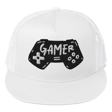 Load image into Gallery viewer, A white trucker hat on a white background showing a close up of the hat. The hat features an embroidered design with an illustrated game controller with the word &#39;gamer&#39; inside the illustration.  